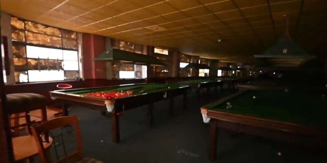The snooker tables still stand in the club