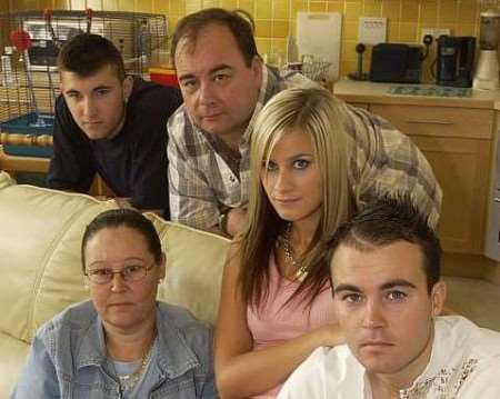 BACK HOME: Michael Phillips, girlfriend Alex, brother Chris and parents Michael and Tina. Picture: JOHN WARDLEY