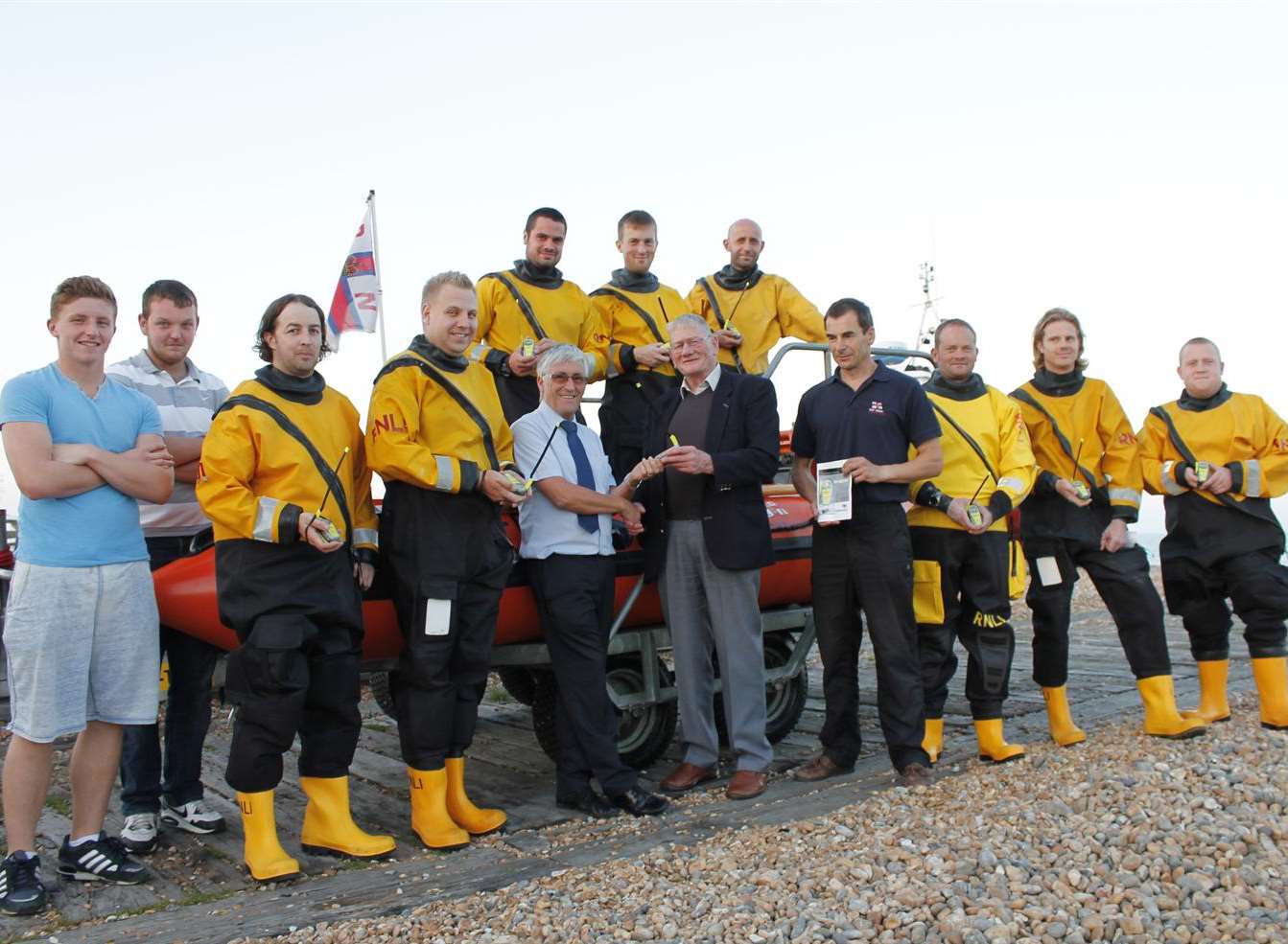 Lifeboat volunteers with their personal locator beacons funded by a donation in memory of a supporter of the station