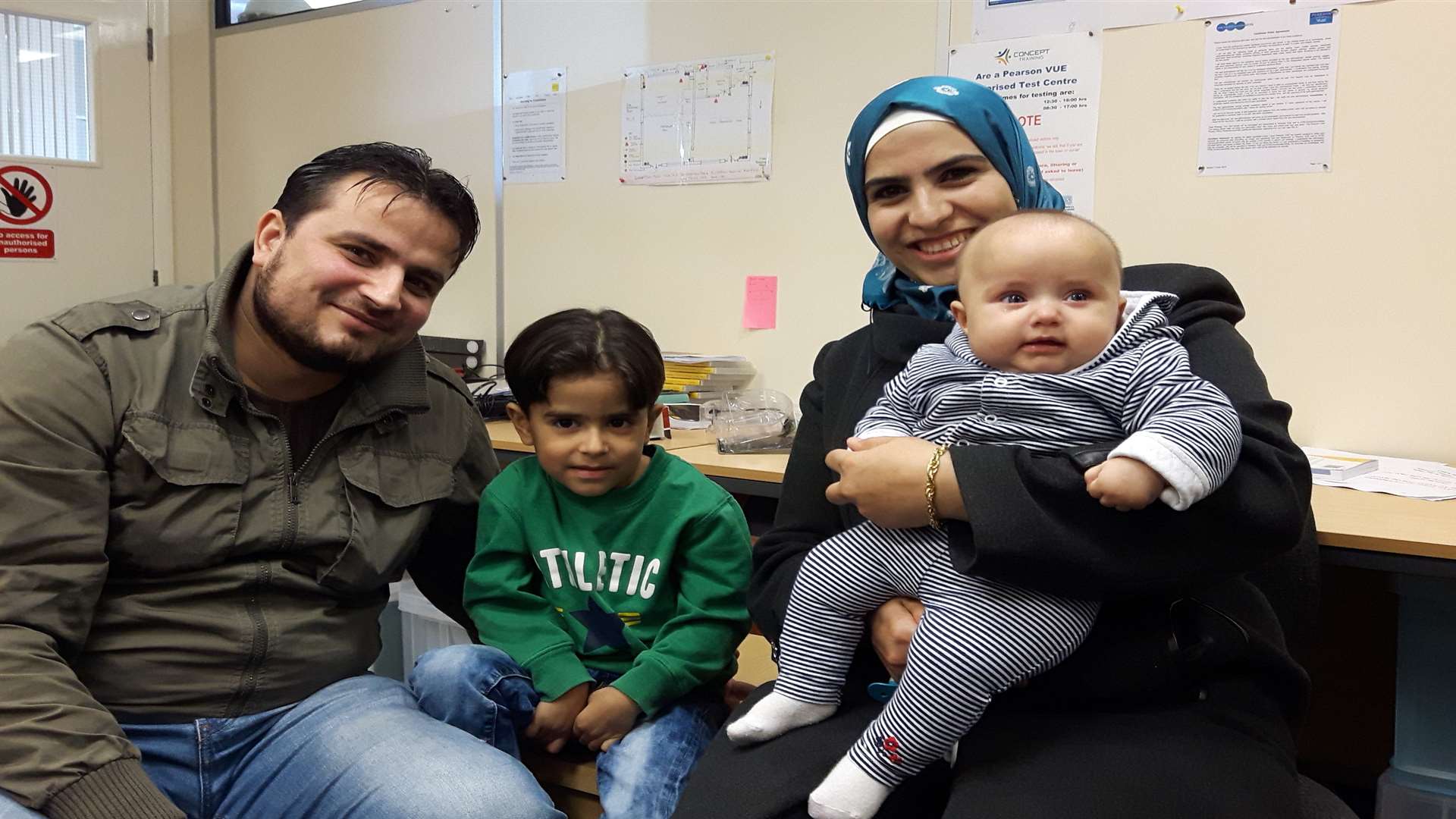 Syrian refugees Ismaeil Ismaeil with his son Rida, and his wife Jamila Nabolsi with her baby son Rital