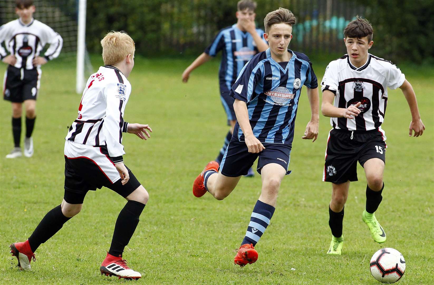 Black Lion Youth under-15 (blue and black stripes) and Milton & Fulston battle it out in Division 1 Picture: Sean Aidan