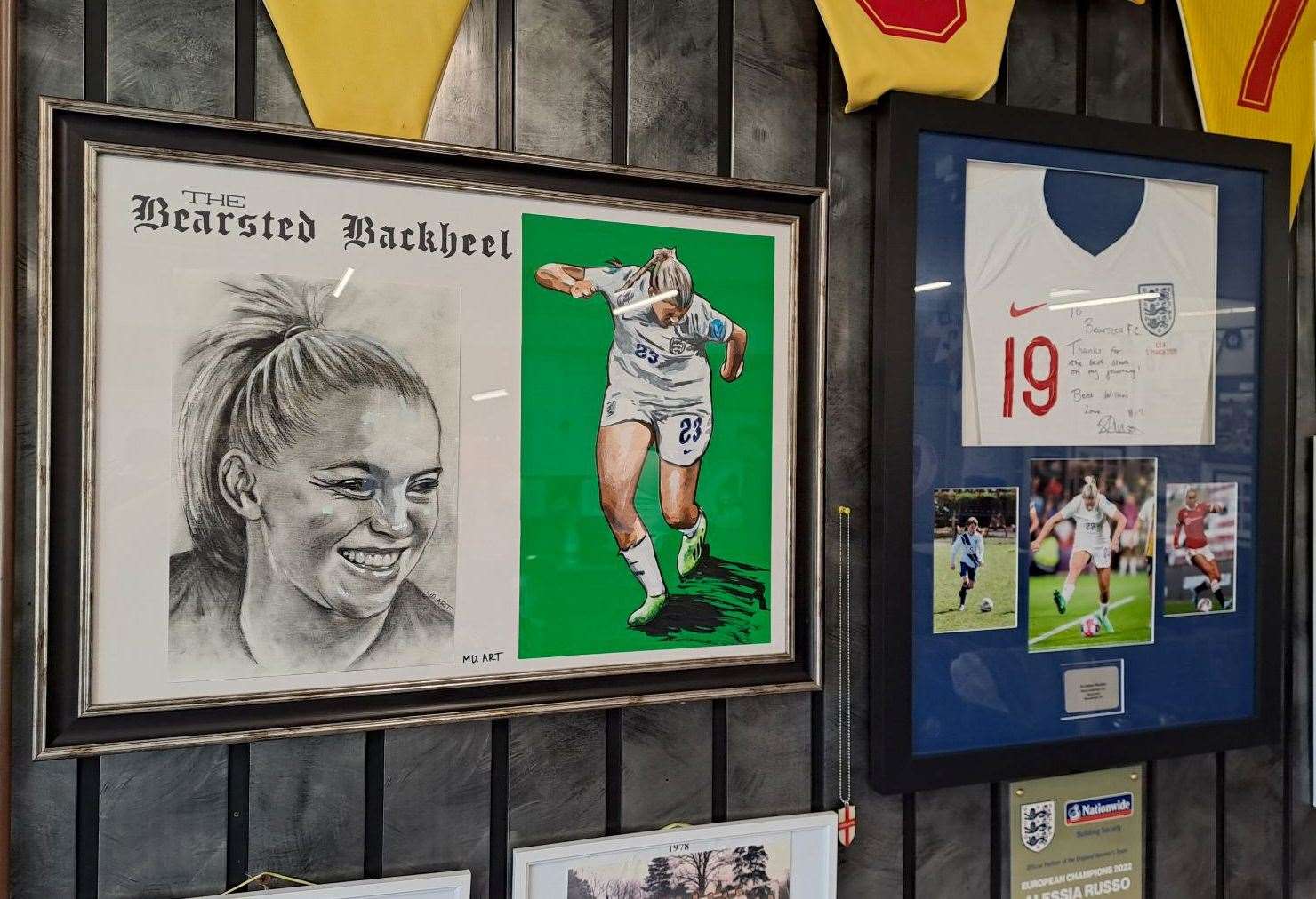 A drawing of Alessia Russo hangs on Bearsted Football Club's wall remembering her famous backheel goal