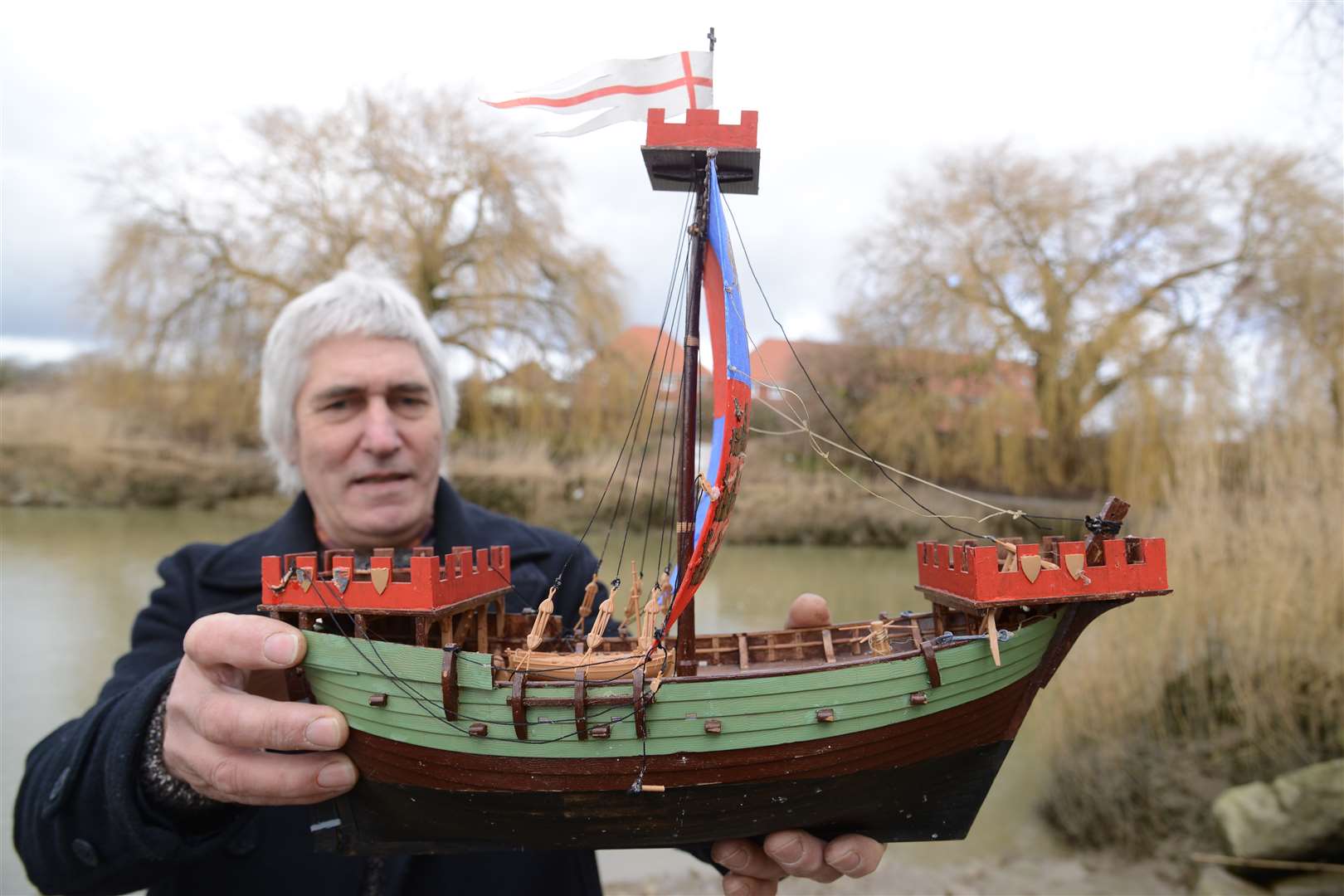 Bob Martin with a model of the medieval ship Sandwich Quay