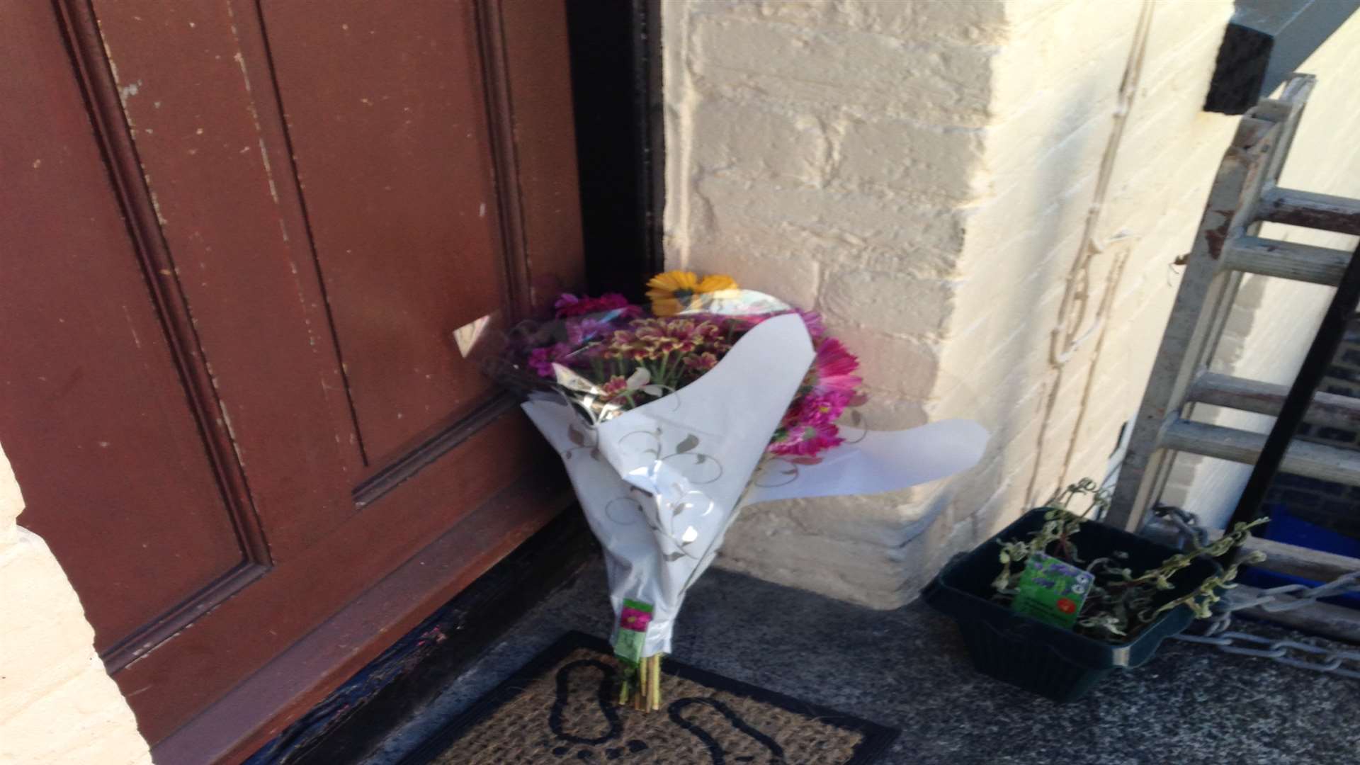 Floral tributes were left out side a house in De Burgh Street, Dover