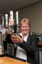 Jayne Boulter pours a pint in the Coniston Hotel's bar