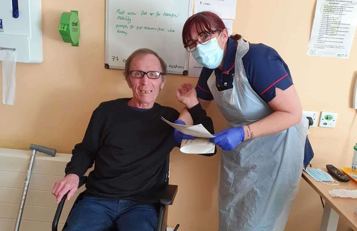 Alan Mason with Niqui Sutton-Walker, clinical sister, during his battle with Covid-19