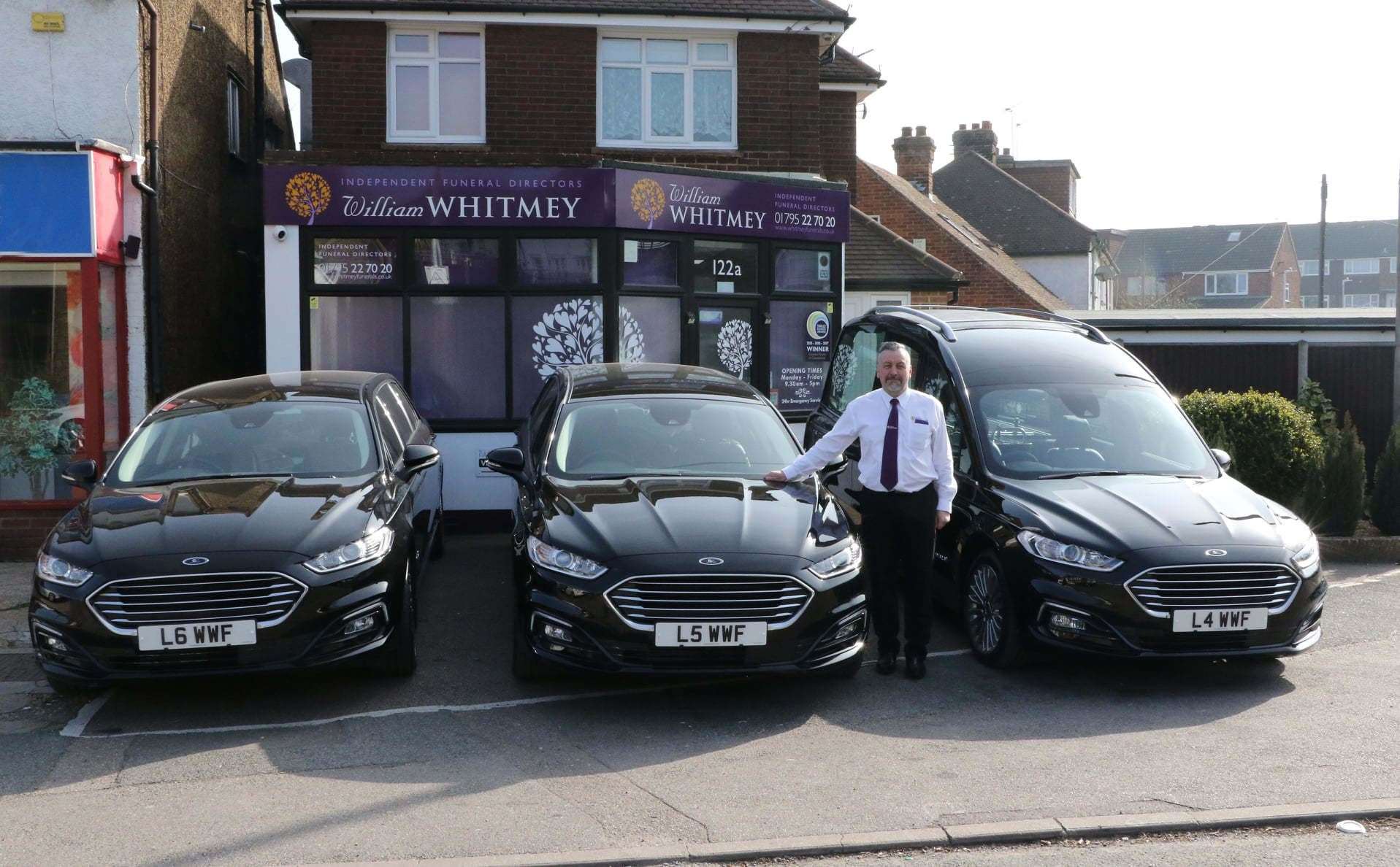 Sittingbourne undertakers William Whitmey Funeral Directors have taken delivery of a new fleet of eco-friendly hybrid limousines and hearse worth £335,000. Pictured with the firm's founder Alex Whitmey