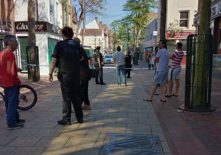 Police stand guard around a cordon in Chatham High Street yesterday. Picture: Nicola Cochran