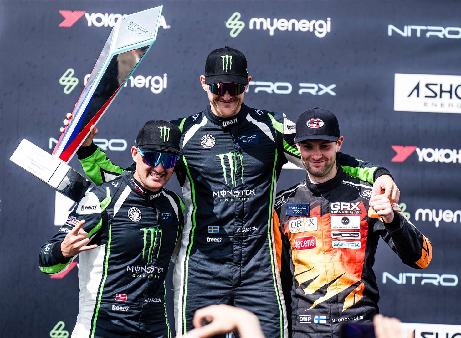 Robin Larsson, centre, celebrates with team-mate Andreas Bakkerud and Niclas Gronholm. Picture: Nitro Rallycross