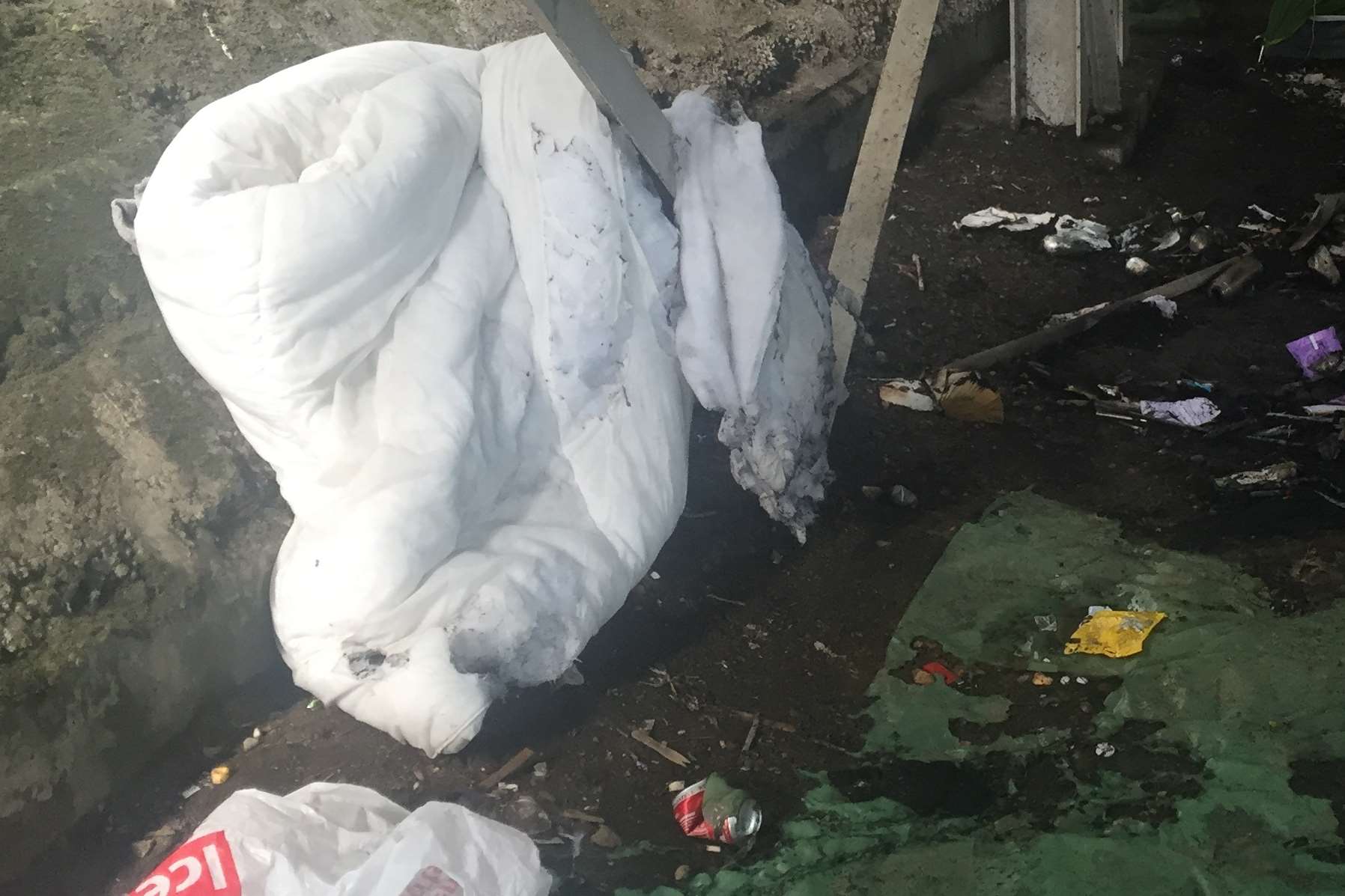 A duvet is saved from the blaze under the multi-storey car park