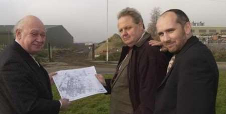 County councillor Alex King, left, Andrew Bowles, of Swale council, and Greg McDonald, of Swale Forward, look at the line of the new road. Picture: ANDY PAYTON