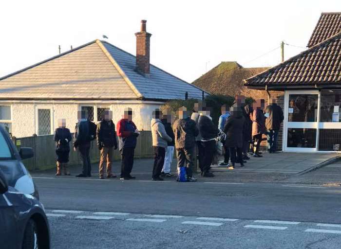 Poorly patients at the Church Lane Surgery in New Romney queueing in the cold