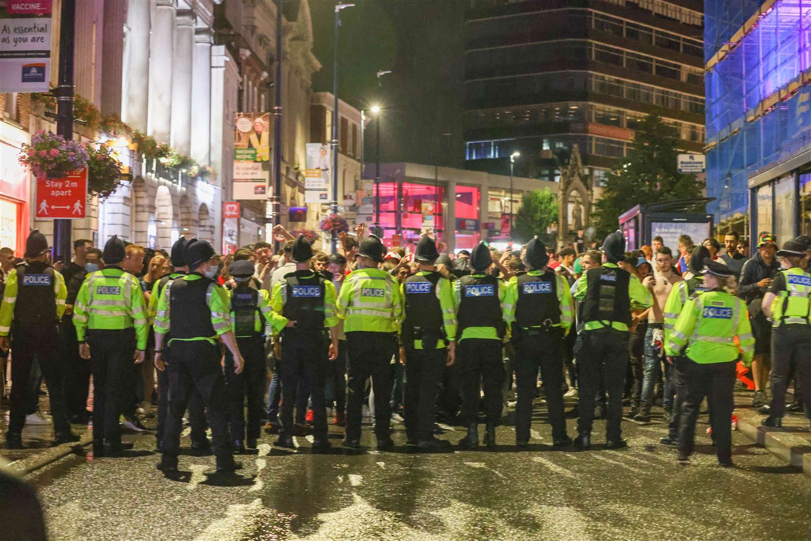 Officers confront crowds after England lost to Italy in the Euro 2020 final Picture: UKNIP