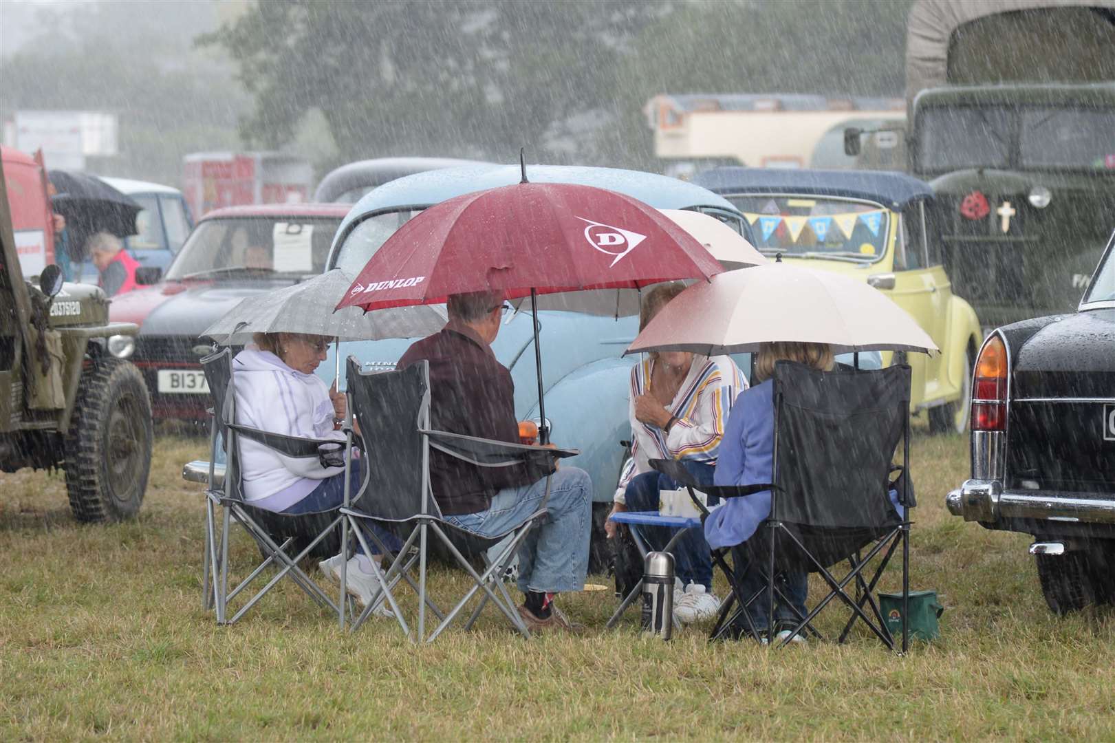 Then the rain came, a heavy shower at the Biddenden Tractorfest. Picture: Chris Davey.