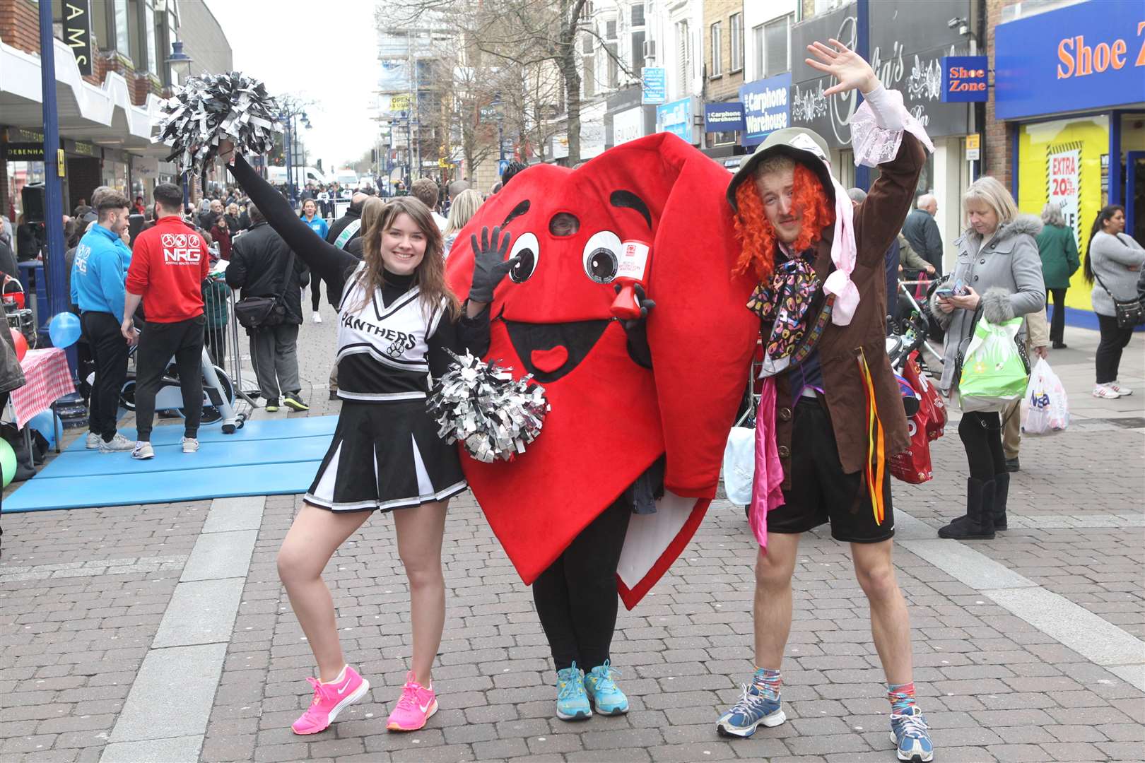 Lizzie Massey, chief reporter and Tom Acres, reporter both from the Gravesend Messenger with Jo Howe from the British Heart Foundation at a pancake race in Gravesend Town Centre