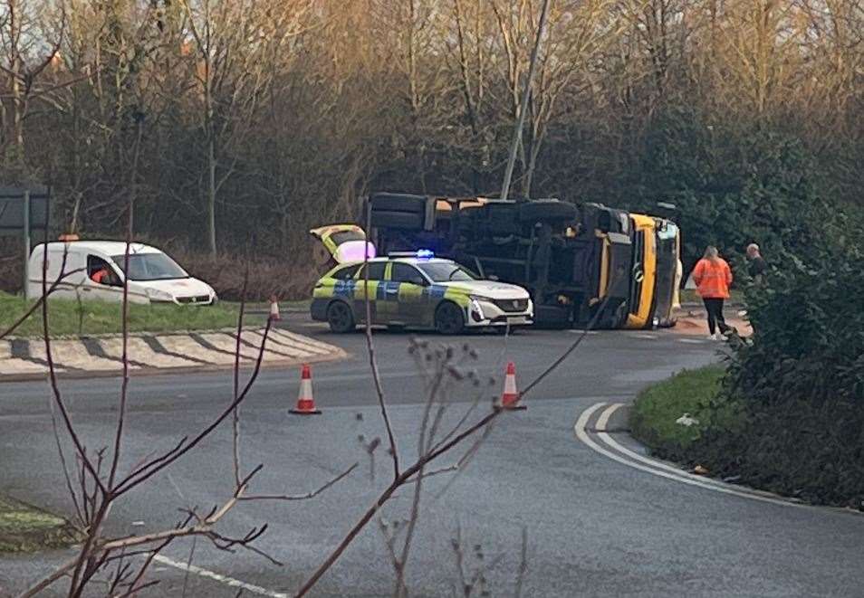 The lorry overturned on the A2070 at about 2.30pm on Friday