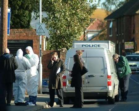 Police forensic experts and members of the media at the scene of the shooting. Pictures: GARY BROWNE