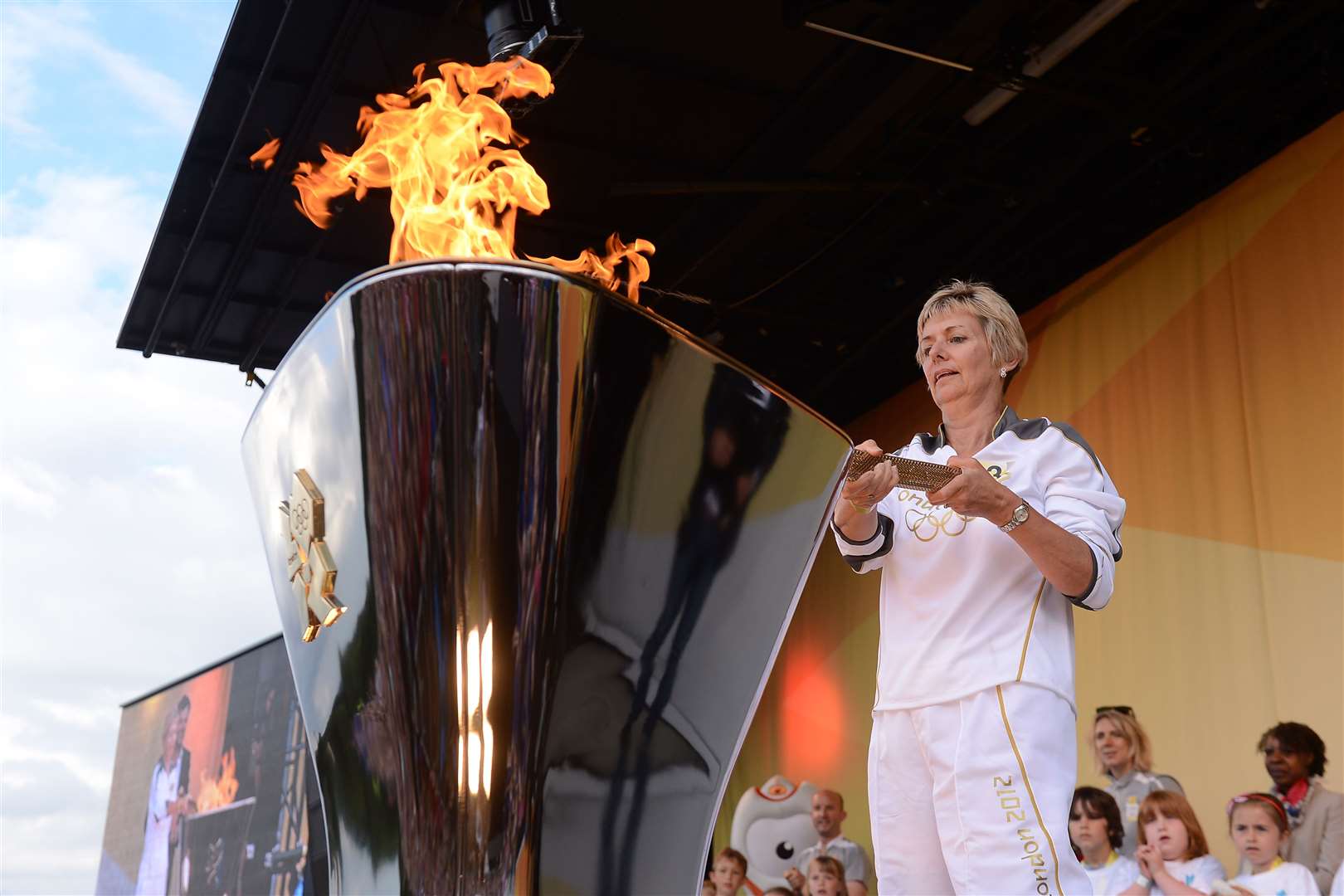 Julia Chilcott lights the cauldron at the end of day 62. Pic: Locog