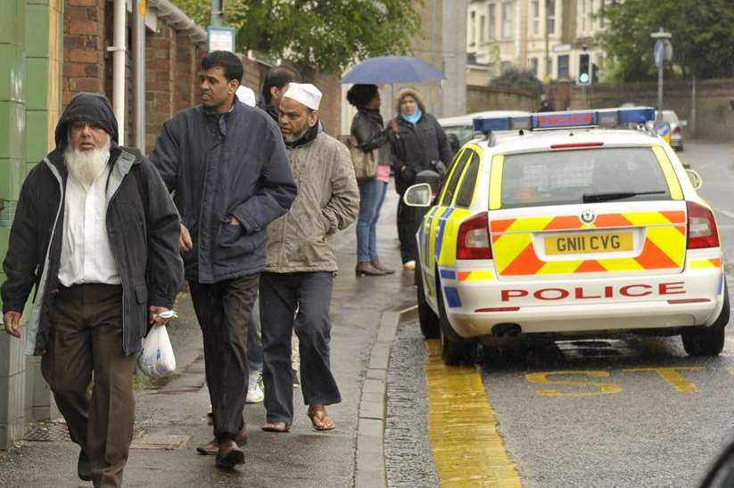 Police cars outside Gillingham Mosque as worshippers arrive