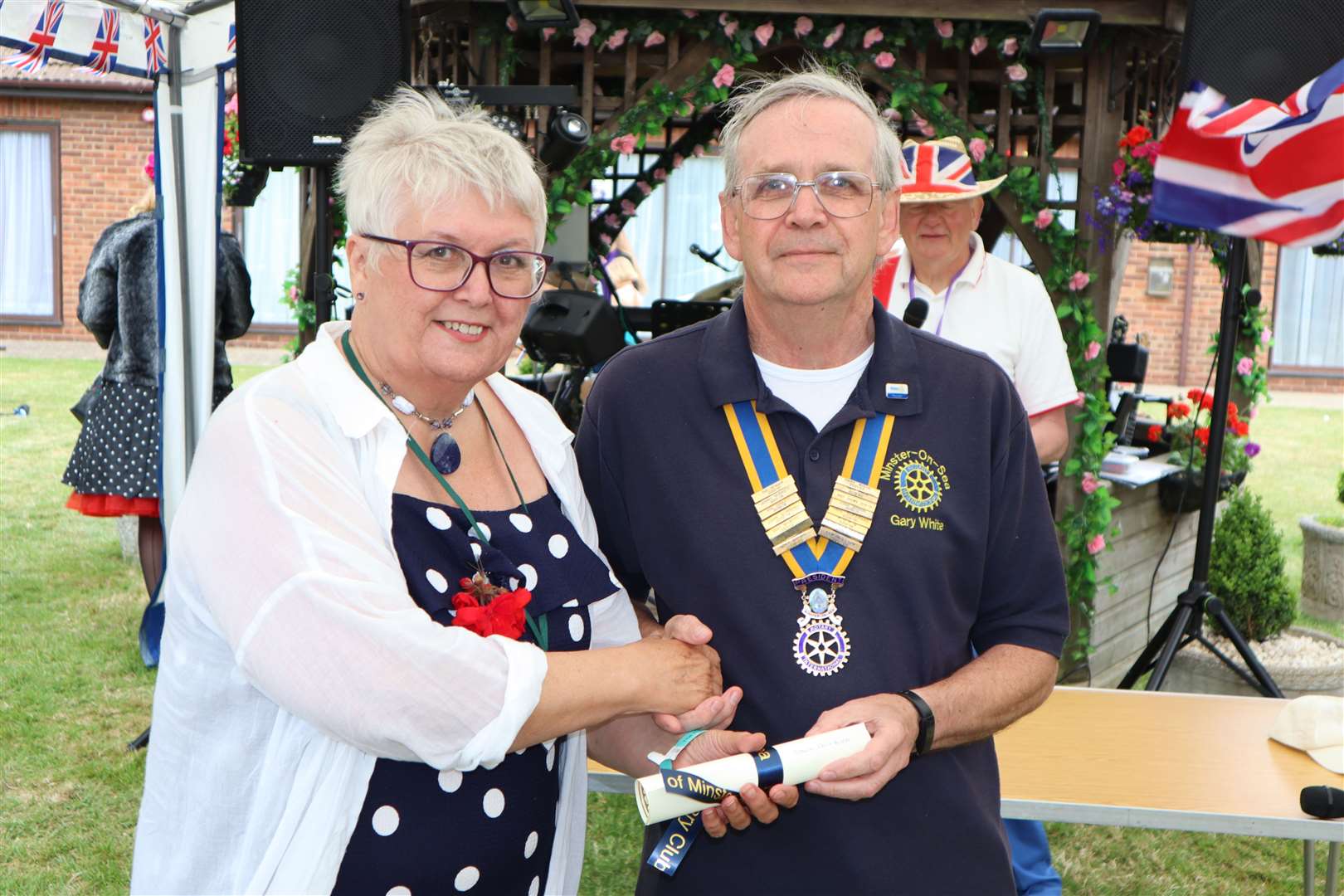 Dawn Cockburn of the Harmony Therapy Trust with president Gary White at Minster-on-Sea Rotary Club's Platinum Jubilee volunteer awards