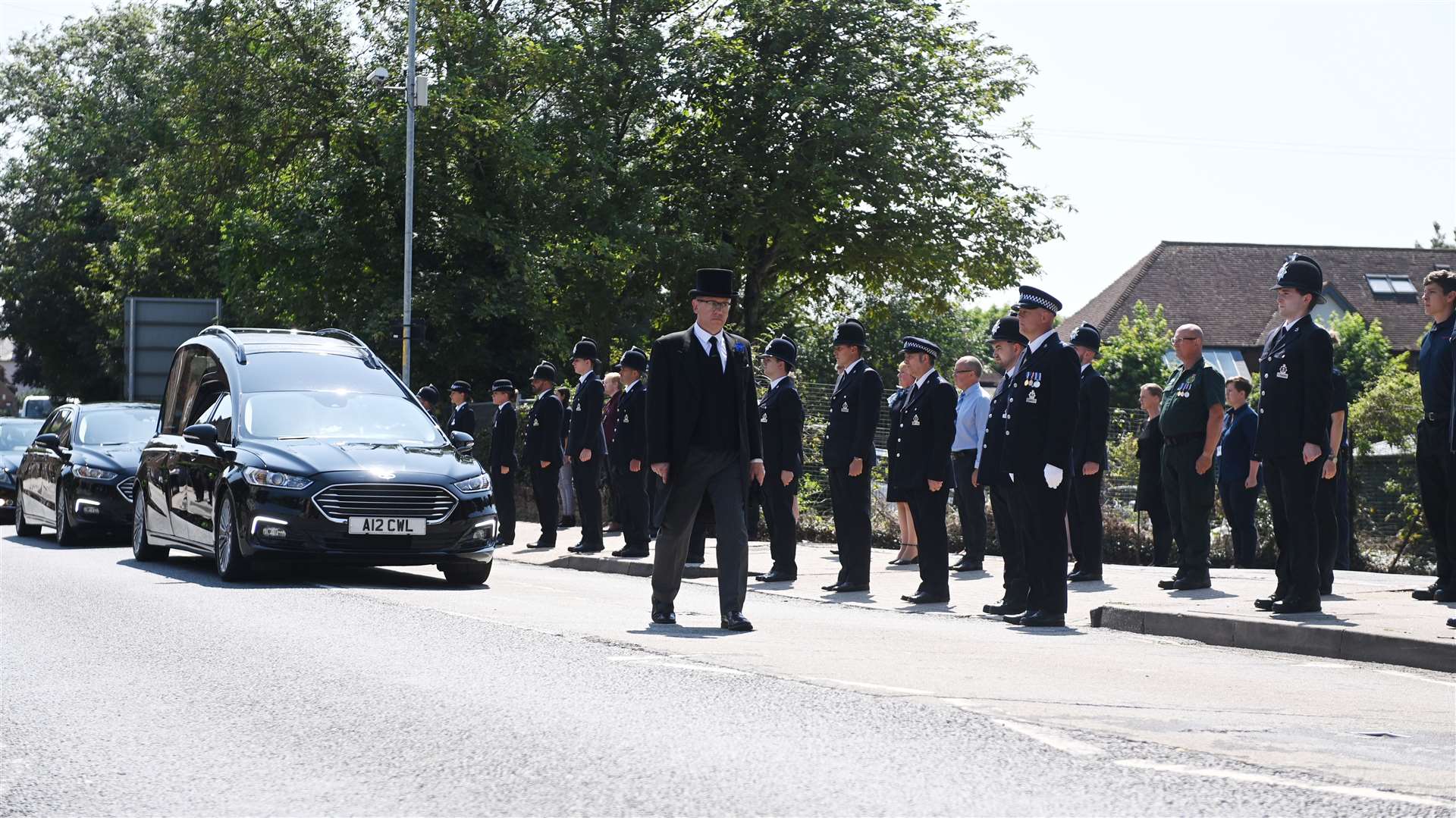Julia James' funeral parade stops at the Canterbury Kent police station in Canterbury, so officers can pay their respect. Picture: Barry Goodwin