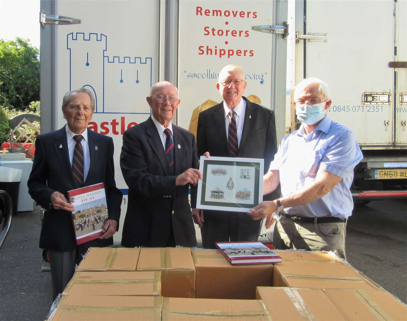 Bill Butler, far right, receives a watercolour painting from RMA Deal branch member John Elms, pictured alongside RMA members Bob Davies and Peter Hall