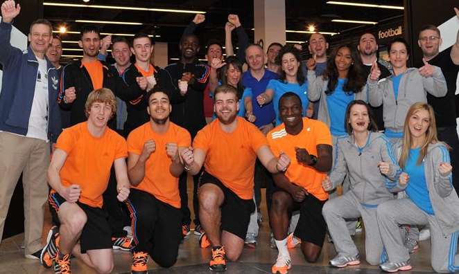 Staff celebrate the opening of the new Adidas store