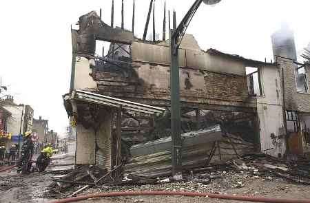 SCENE OF DEVASTATION: The remains of the greengrocers. Picture: GRANT FALVEY