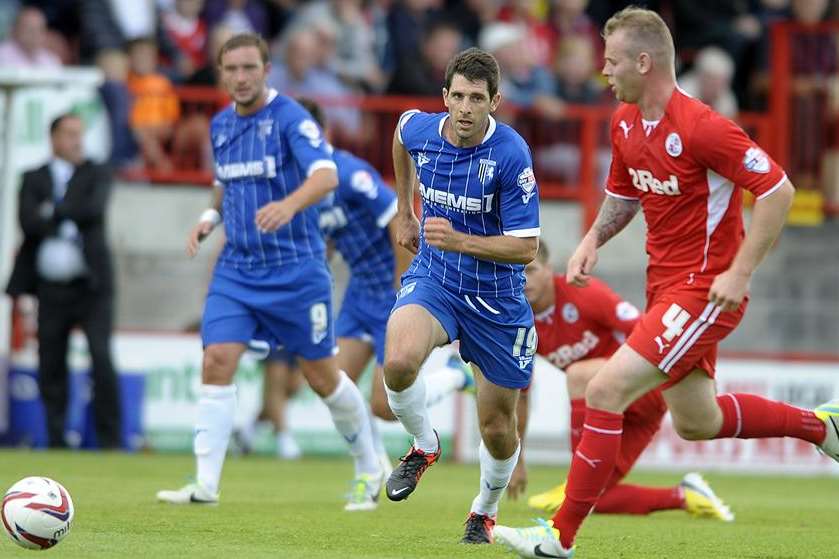 Danny Hollands looks to win back possession for Gillingham against Crawley. Picture: Barry Goodwin