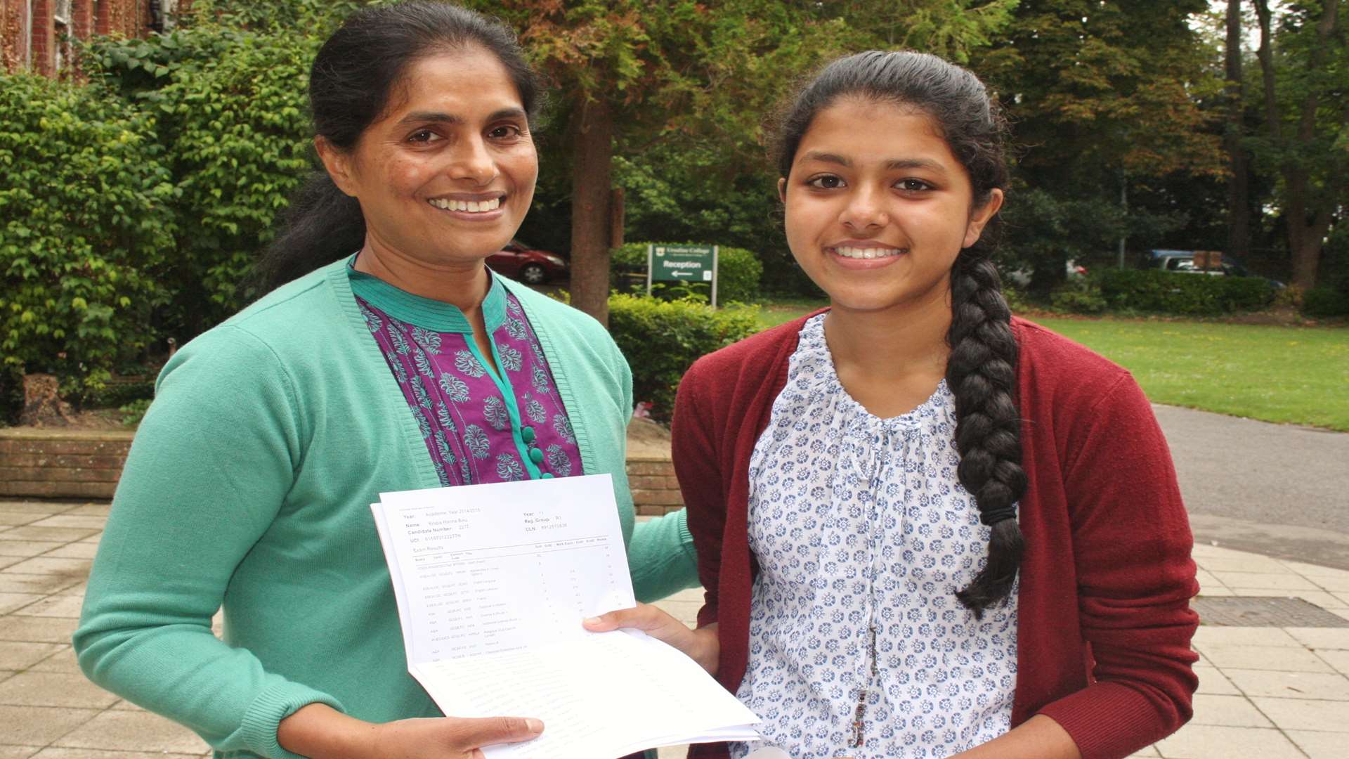 Krupa Binu is congratulated by her mum Alice after learning that she gained two A*s five As, two Bs and a merit on GCSE results day at Ursuline College
