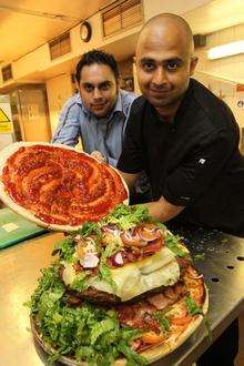 Chef Sudeep De with his general manager Karan Sobti with the 11k burger at Larkfield's Hamlets Hotel