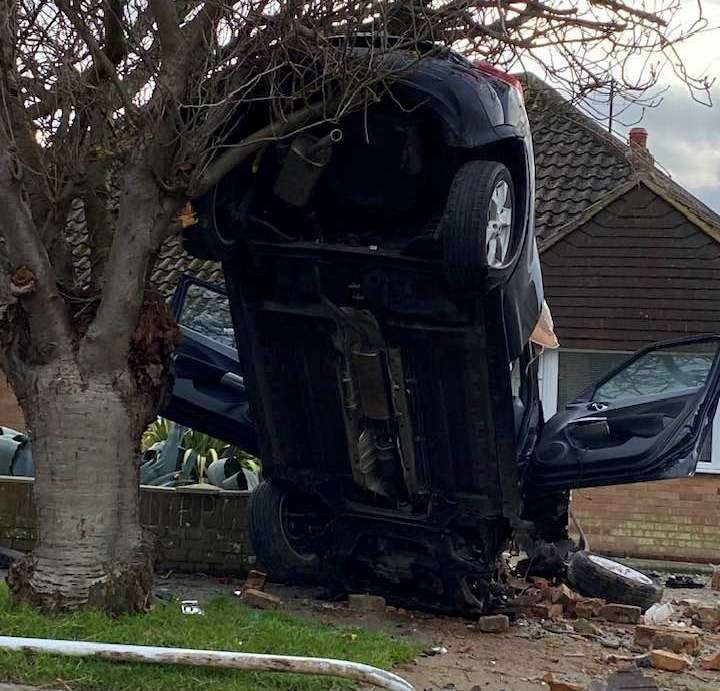 The car ended up leaning against a tree in Birchington. Picture: Terry Thompson
