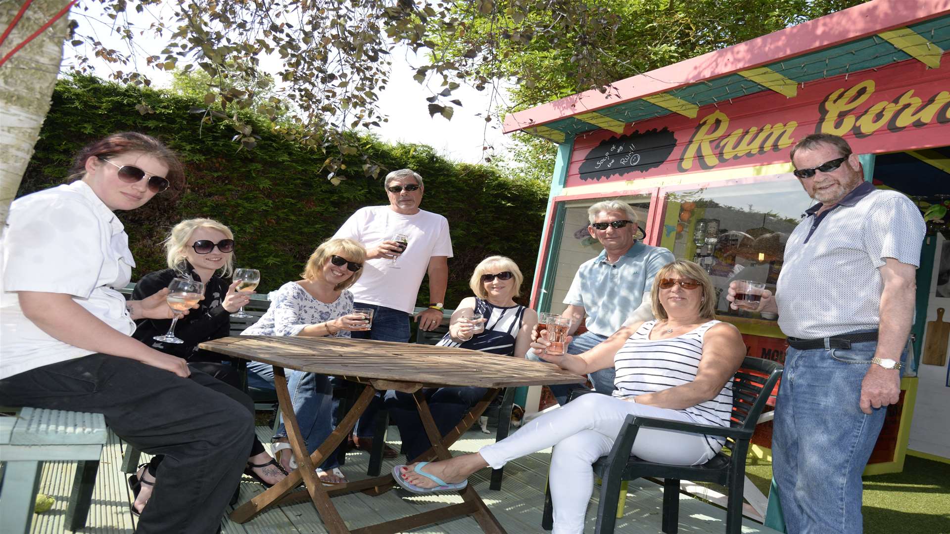 Rum Corner, Deborah and Nick Siminson and friends outside their bar built in a shed at the end of their garden. Picture: Chris Davey