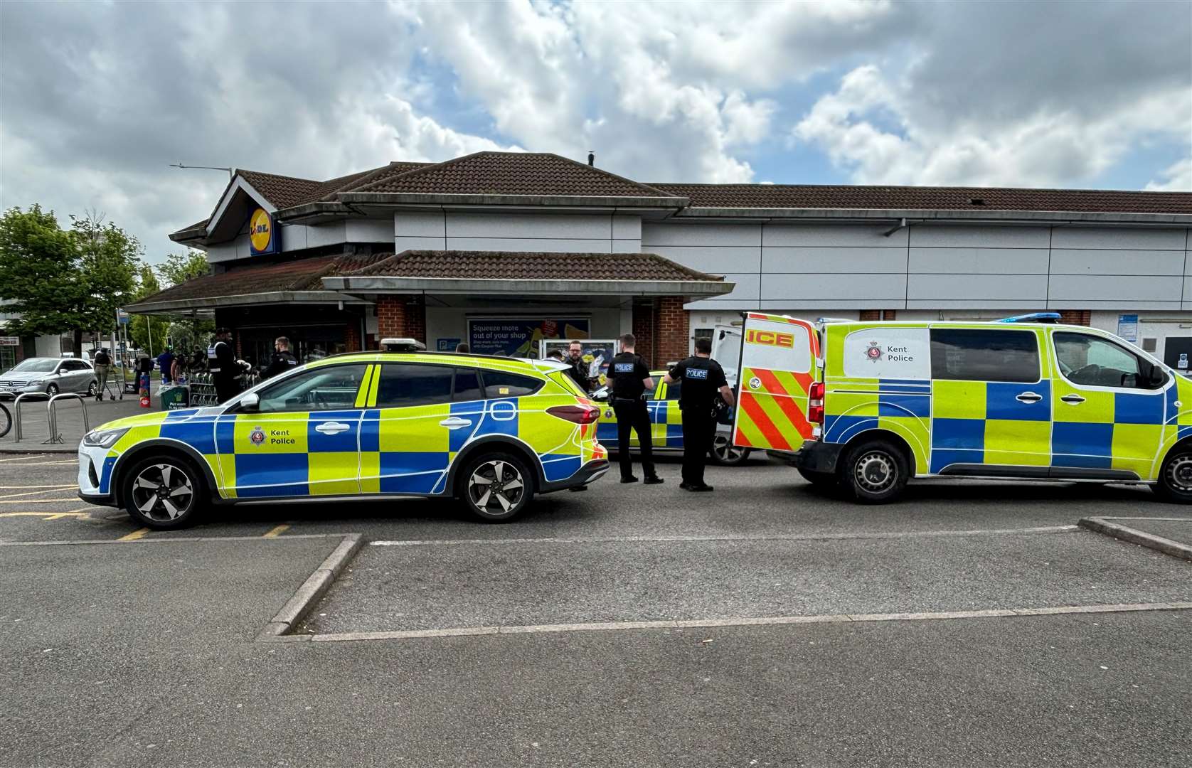 Four police cars were in attendance at Lidl in Ashford this lunchtime. Picture: Joe Harbert