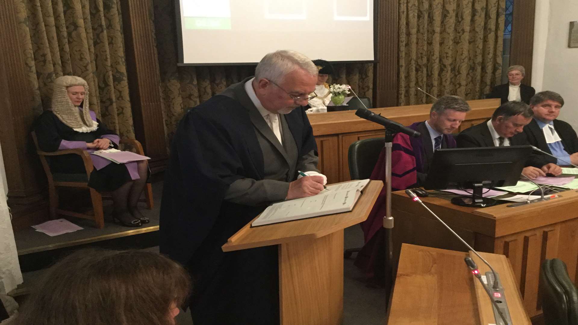 Cllr Colin Spooner signs the register to formally become Sheriff of Canterbury.