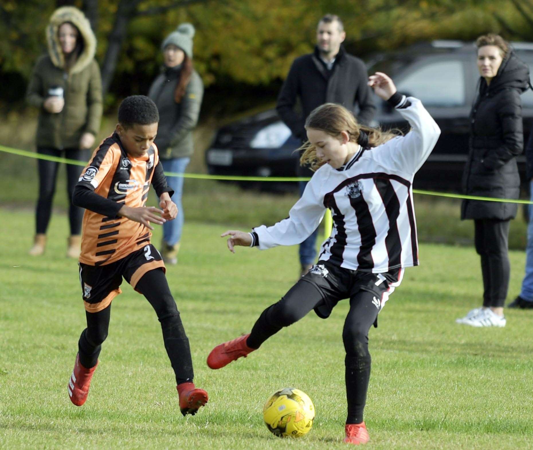 Milton & Fulston United under-13s (black/white) on the ball against Rochester City under-13s. Picture: Barry Goodwin (42641117)
