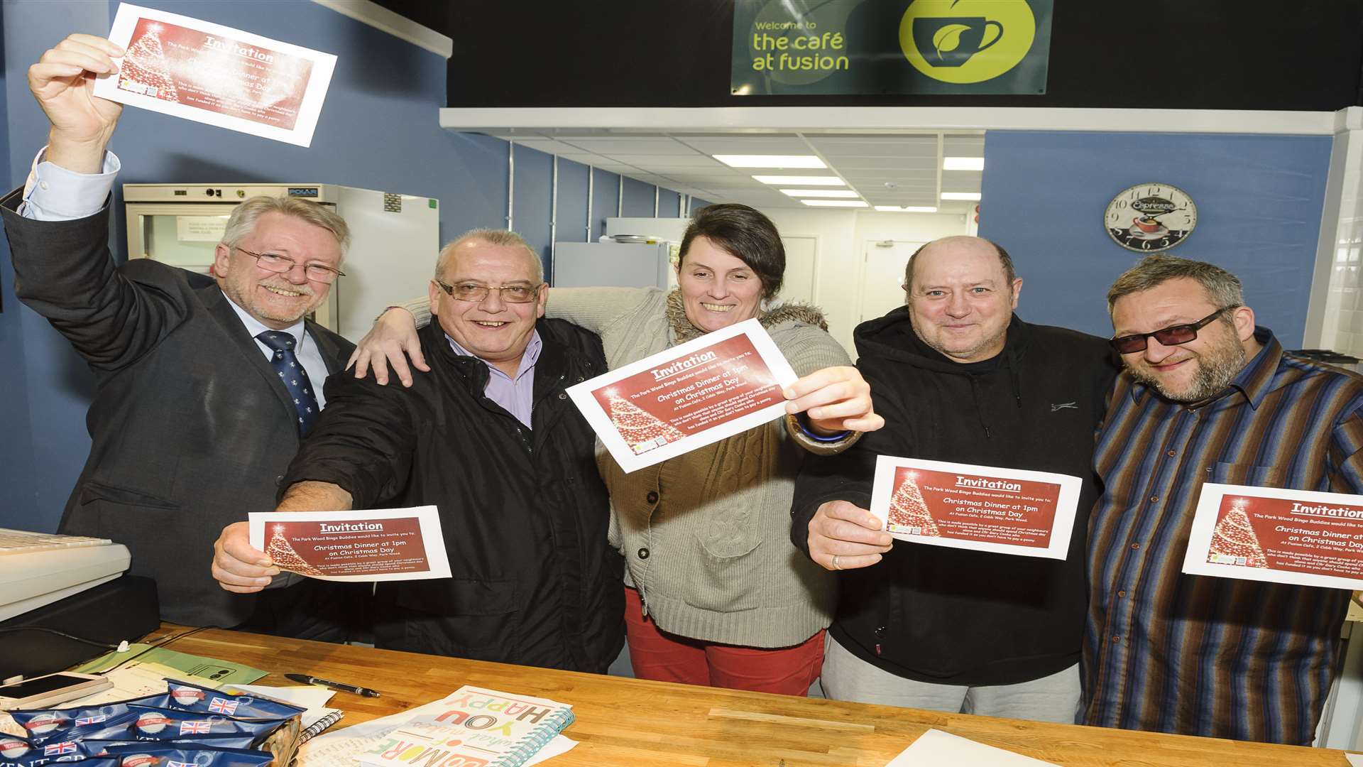 Cllr Gary Cooke, community champion Del Doyle, Nikki Trundle, Keith Whibley, and Paul Billanie hold the invitations to Christmas Dinner. Picture by Andy Payton