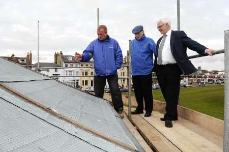 Up on the roof: Andy Gray shows Bill Butler and Dave Ingram the work in progress