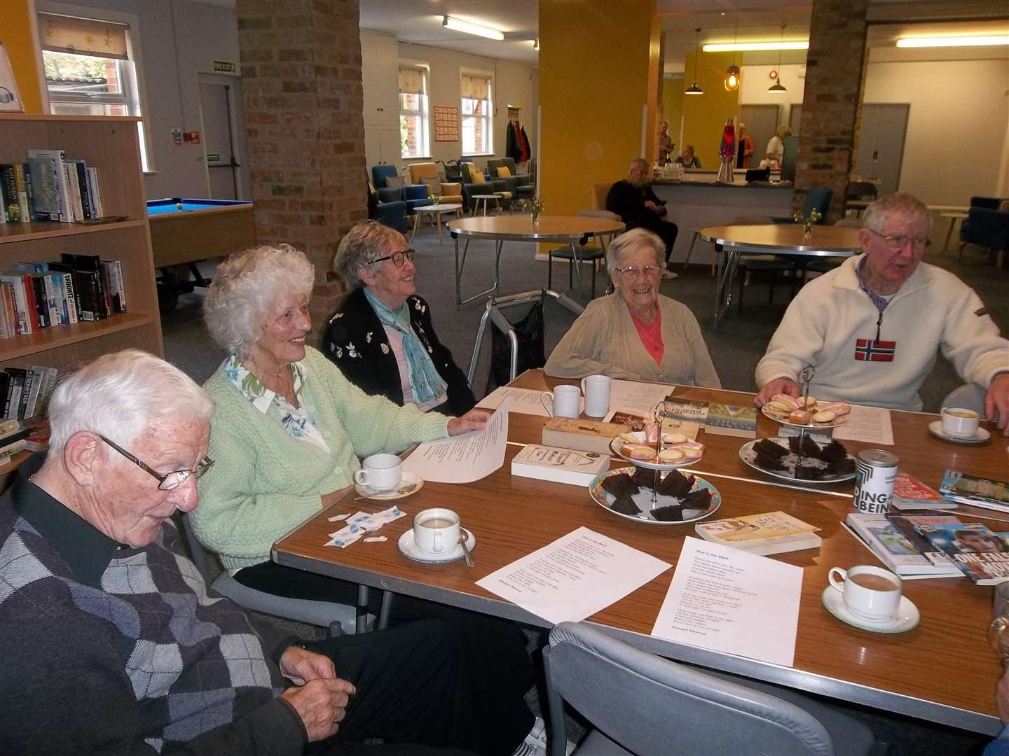 The Bookbinders group at Age UK in Folkestone received an afternoon tea for winning a reading challenge.