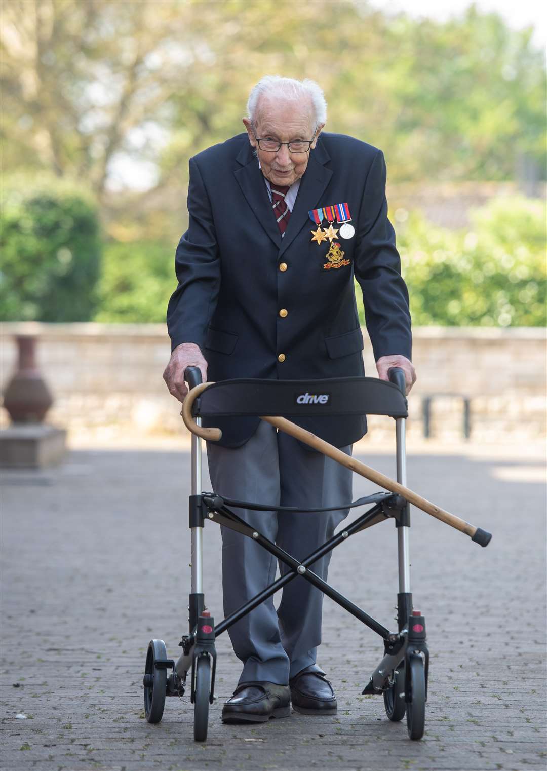 Captain Tom Moore, 99, has raised more than £13m for the NHS by walking 100 laps of his garden (Joe Giddens/PA)