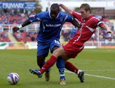 NO WAY THROUGH: Gills' Delroy Facey is tackled by Jamie Vincent. Picture: MATTHEW WALKER