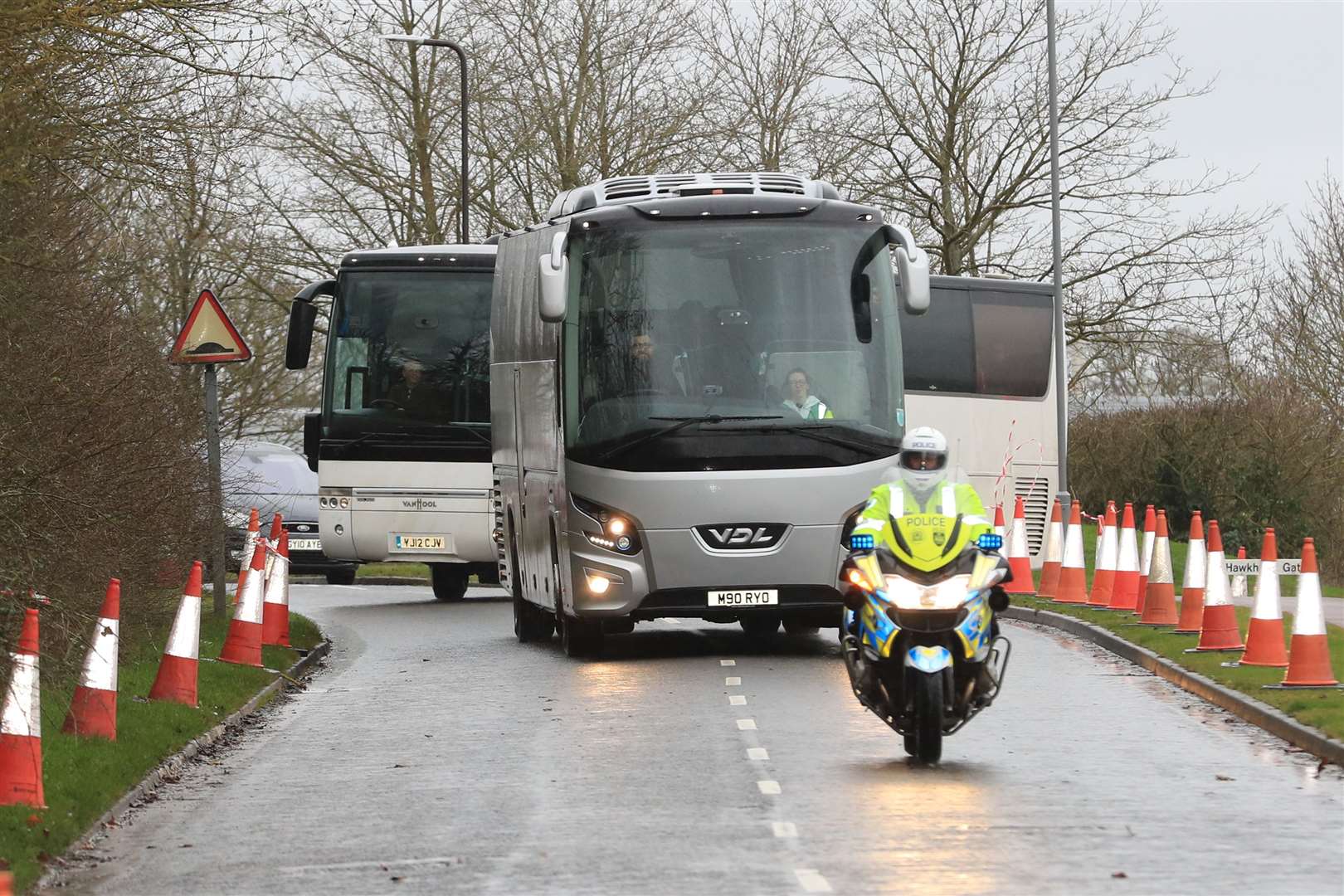 Coaches carrying coronavirus evacuees repatriated to the UK from Wuhan arrive at Kents Hill Park Training and Conference Centre in Milton Keynes (Aaron Chown/PA)