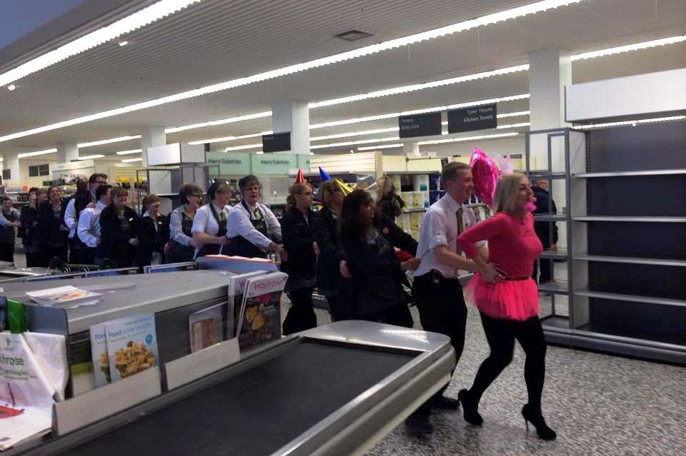 Staff do the conga at Waitrose which closes for the last time today
