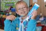 Seven-year-old Luke Hall practises his brushing