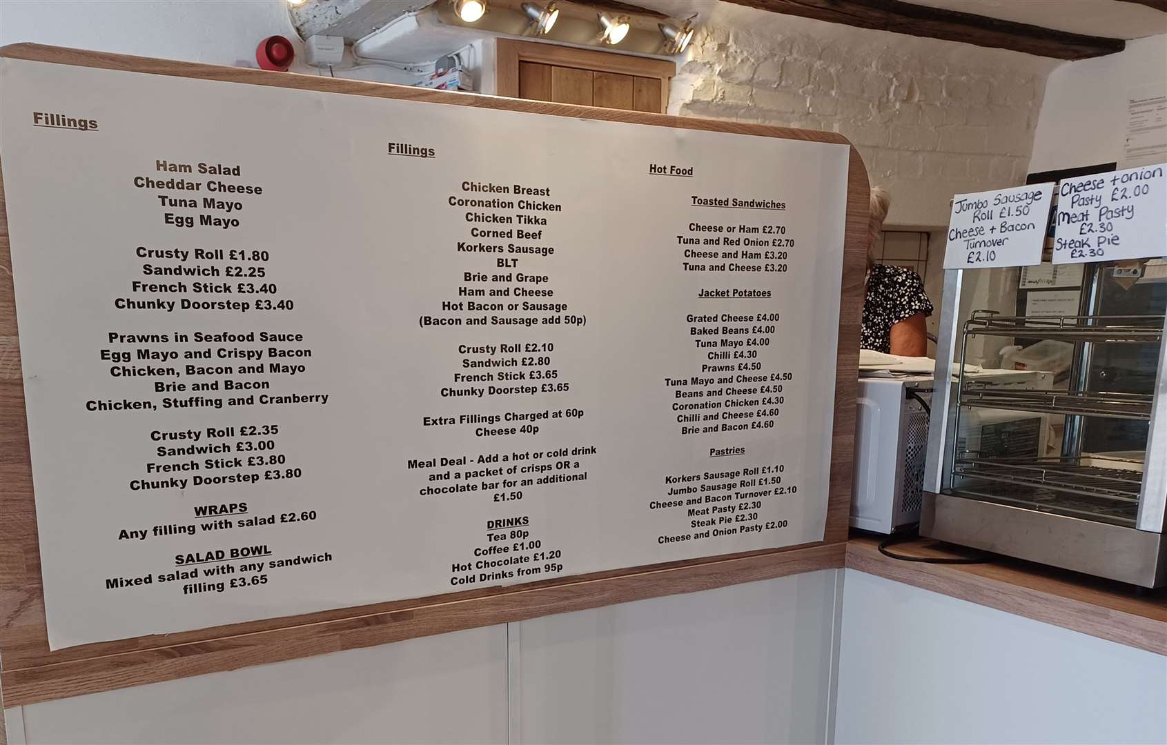 The menu board in the Tucked Away take away in Ashford