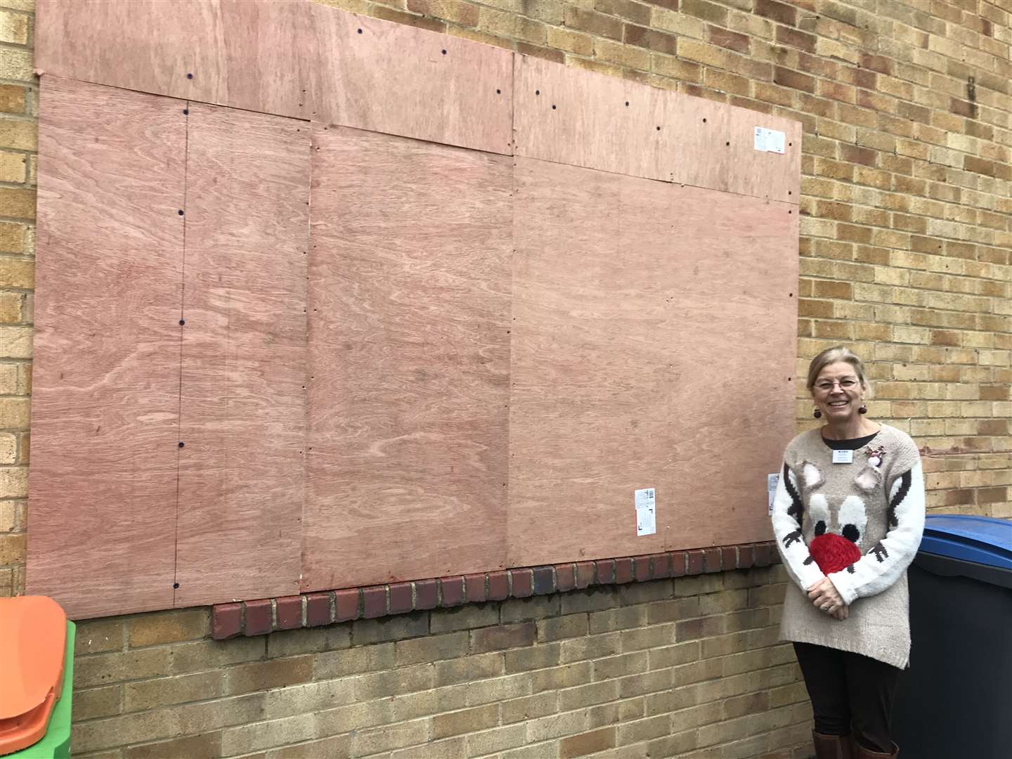 Amanda Sidwell, MADM founder, beside the office window that was smashed by burglars