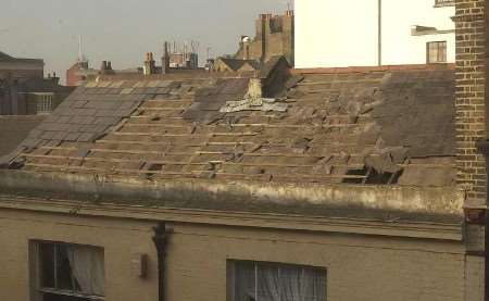 The roof of a house stripped of most of its tiles. Picture: MATTHEW READING
