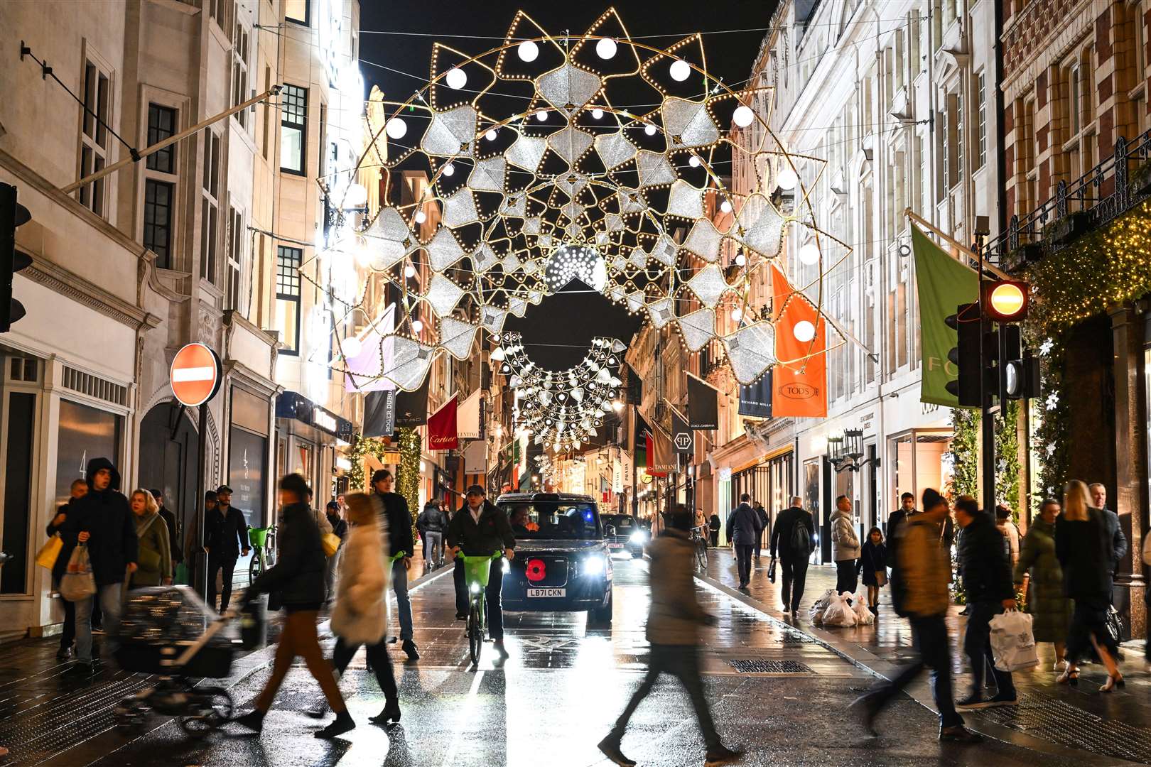 Shoppers have been taking in the festive spirit as they pick up gifts on Bond Street, London (Matt Crossick/PA)