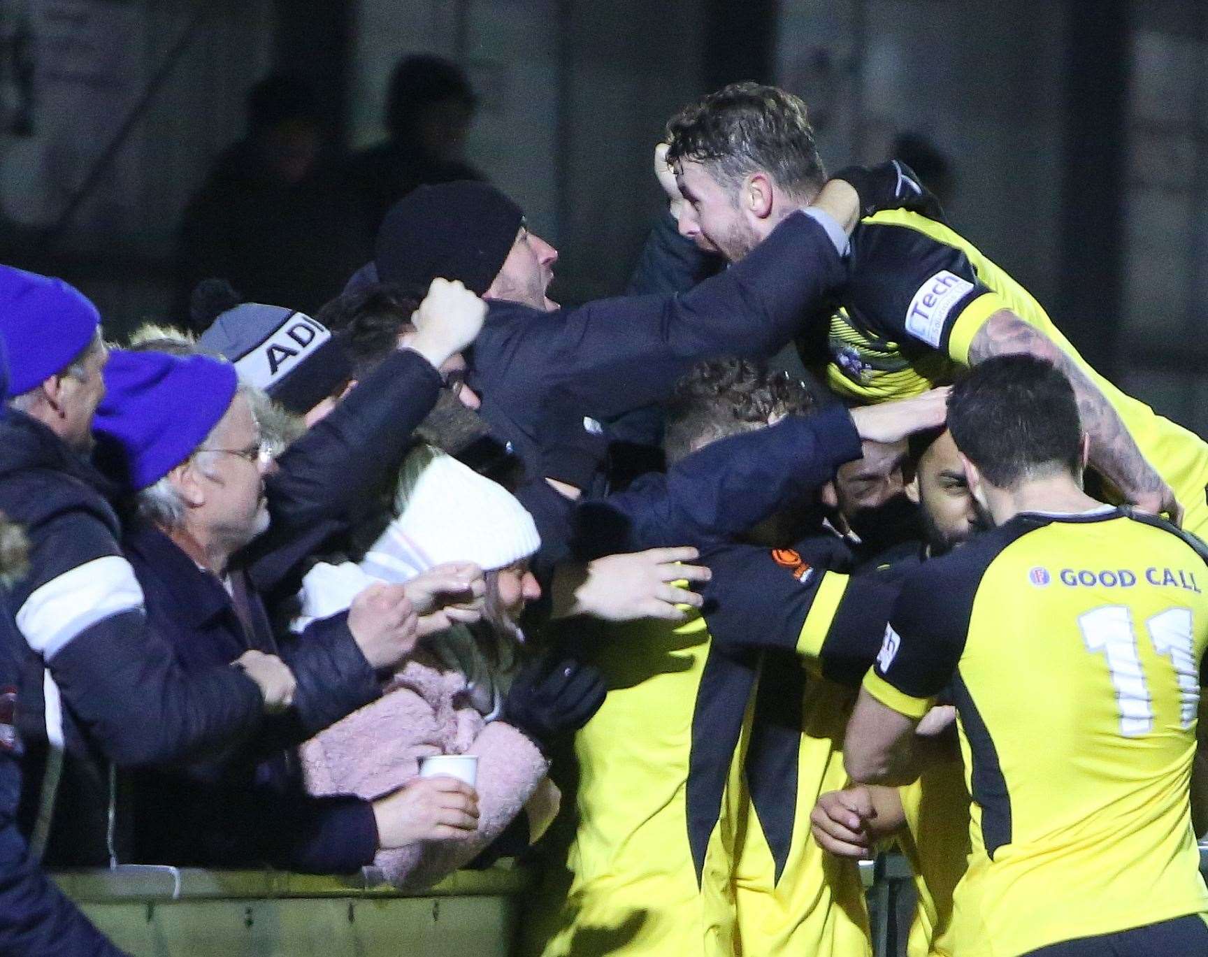 Substitute Adam Coombes celebrates his stoppage-time equaliser with Tonbridge's fans at Havant. Picture: Dave Couldridge