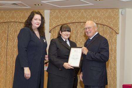 Hannah Park receives her award from KFRS chief executive Ann Millington and KMFRS chairman Bryan Cope